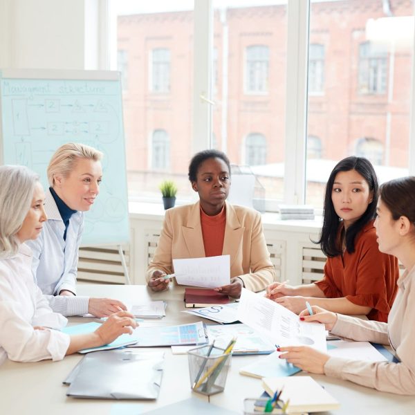 Group of Businesswomen at Meeting in Office