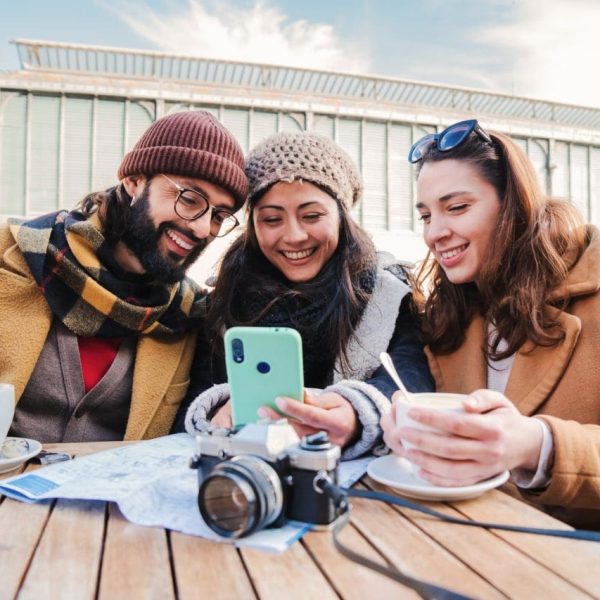 group-of-young-friends-having-fun-watching-videos-on-a-social-media-app-using-a-cellphone-device-it.jpg