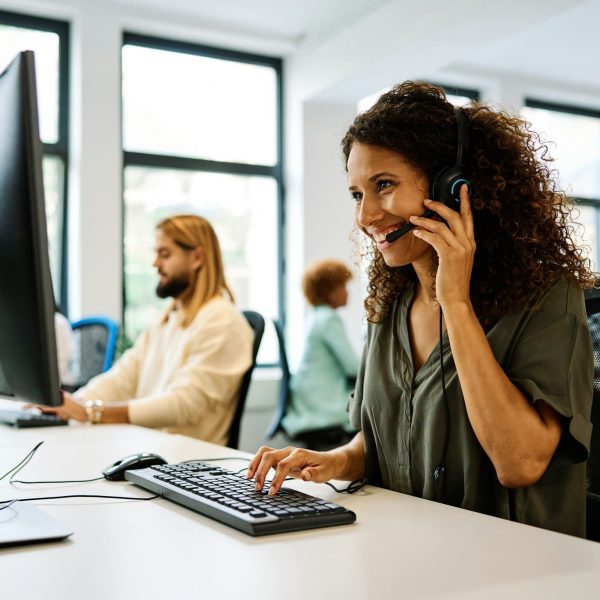 Woman working with computer in a coworking call center