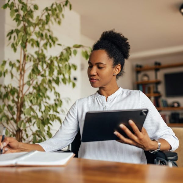 Workplace, home office, black woman working online.